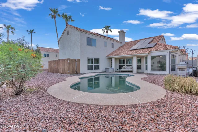 a view of a house with a swimming pool