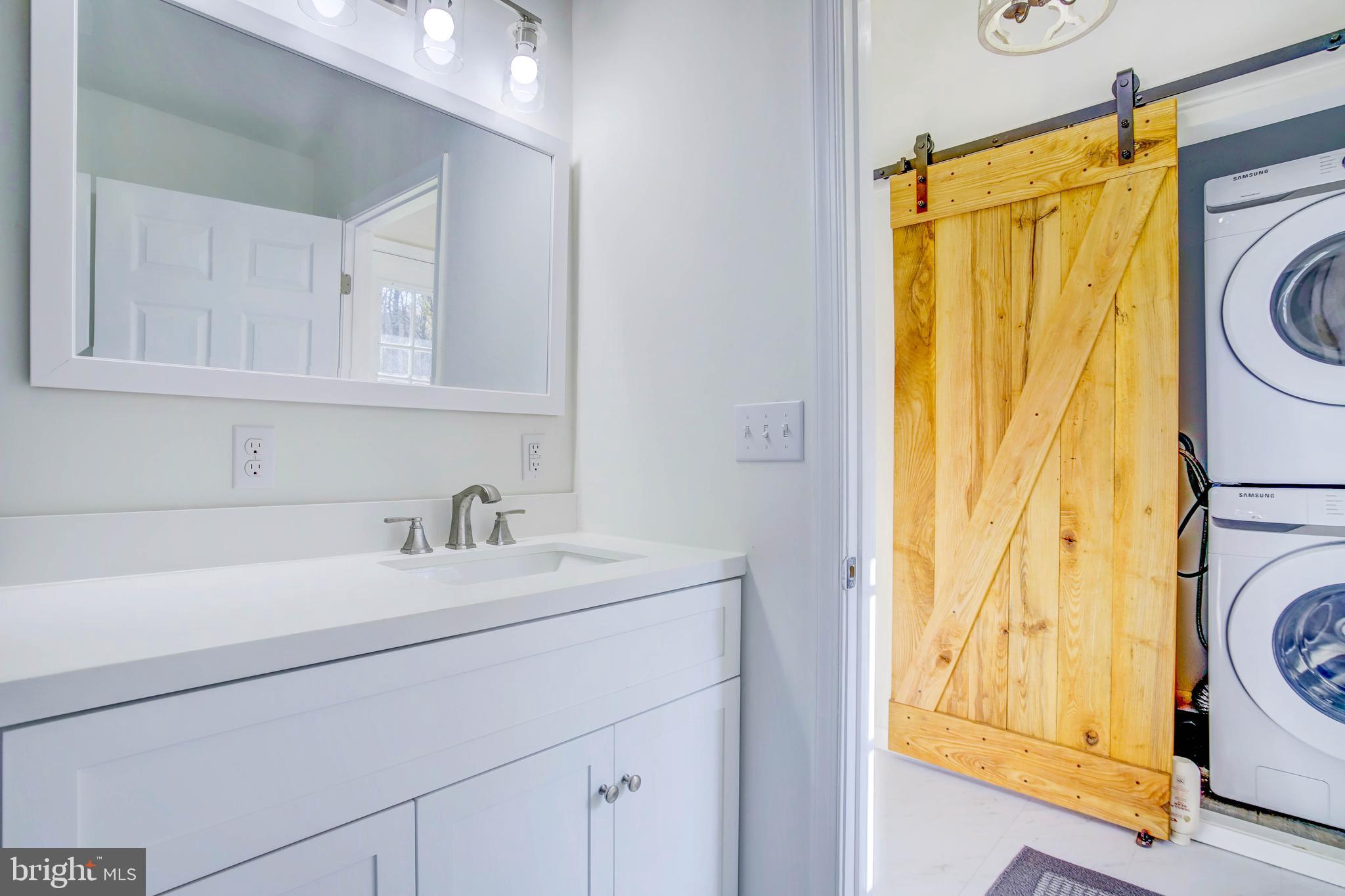 2229 Hudson Road Cambridge, MD 21613 - Photo 36 of 41 a bathroom with a sink a mirror and a shower
