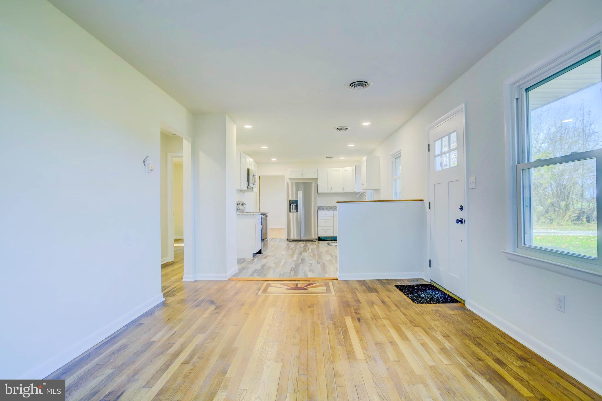 2229 Hudson Road Cambridge, MD 21613 - Photo 10 of 41 a view of a room with wooden floor and a window