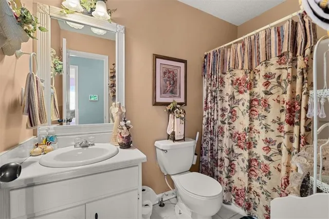 a view of a livingroom with wooden furniture and windows