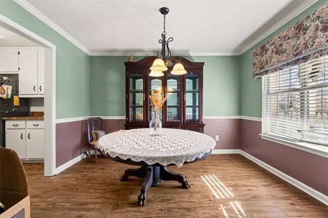 a kitchen with stainless steel appliances granite countertop a refrigerator a stove and a sink