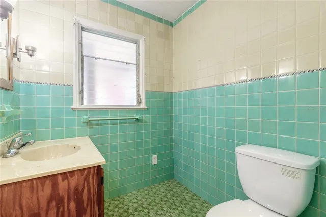 a kitchen with stainless steel appliances granite countertop a stove sink and cabinets