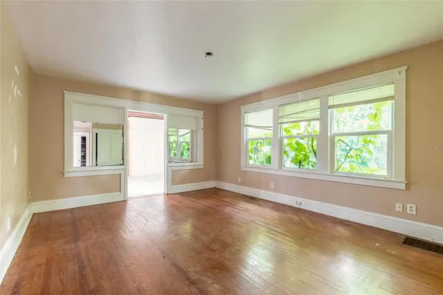 a view of an empty room with a window