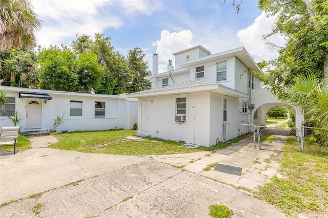 an aerial view of residential houses with city view