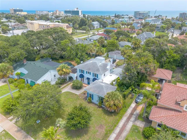 an aerial view of residential houses with outdoor space