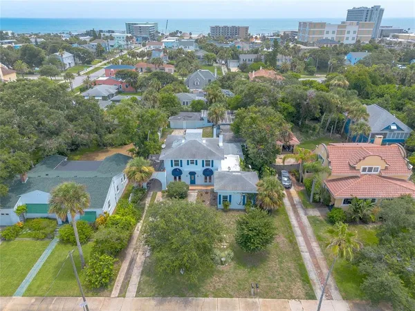 an aerial view of a house with a yard