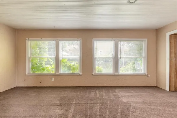 an empty room with windows