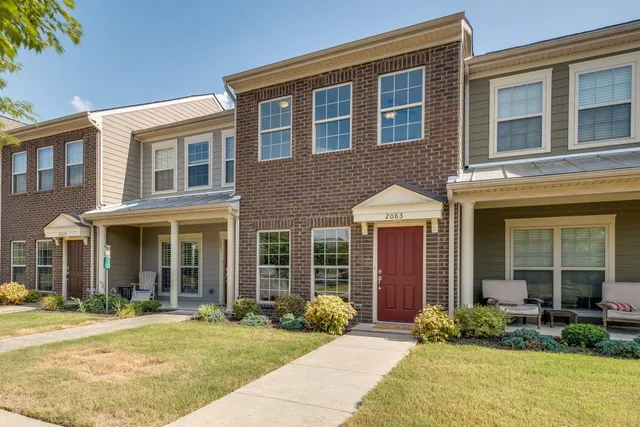 a front view of a house having yard