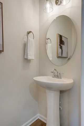 a bathroom with a sink and mirror
