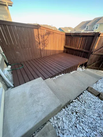 a view of balcony with wooden floor
