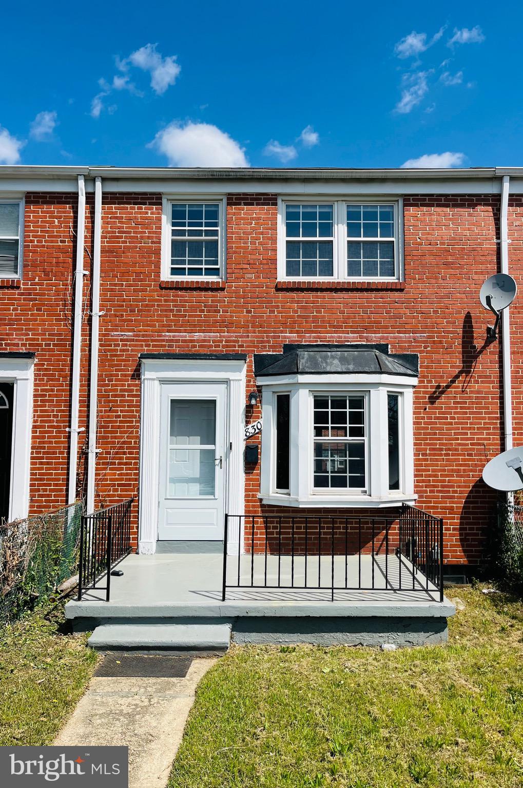 830 Arncliffe Road Baltimore, MD 21221 - Photo 11 of 12 front view of a house with a yard