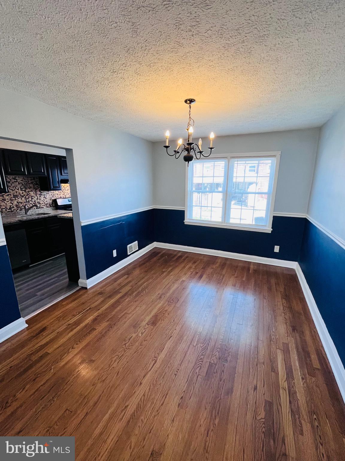 830 Arncliffe Road Baltimore, MD 21221 - Photo 5 of 12 a view of an empty room and window