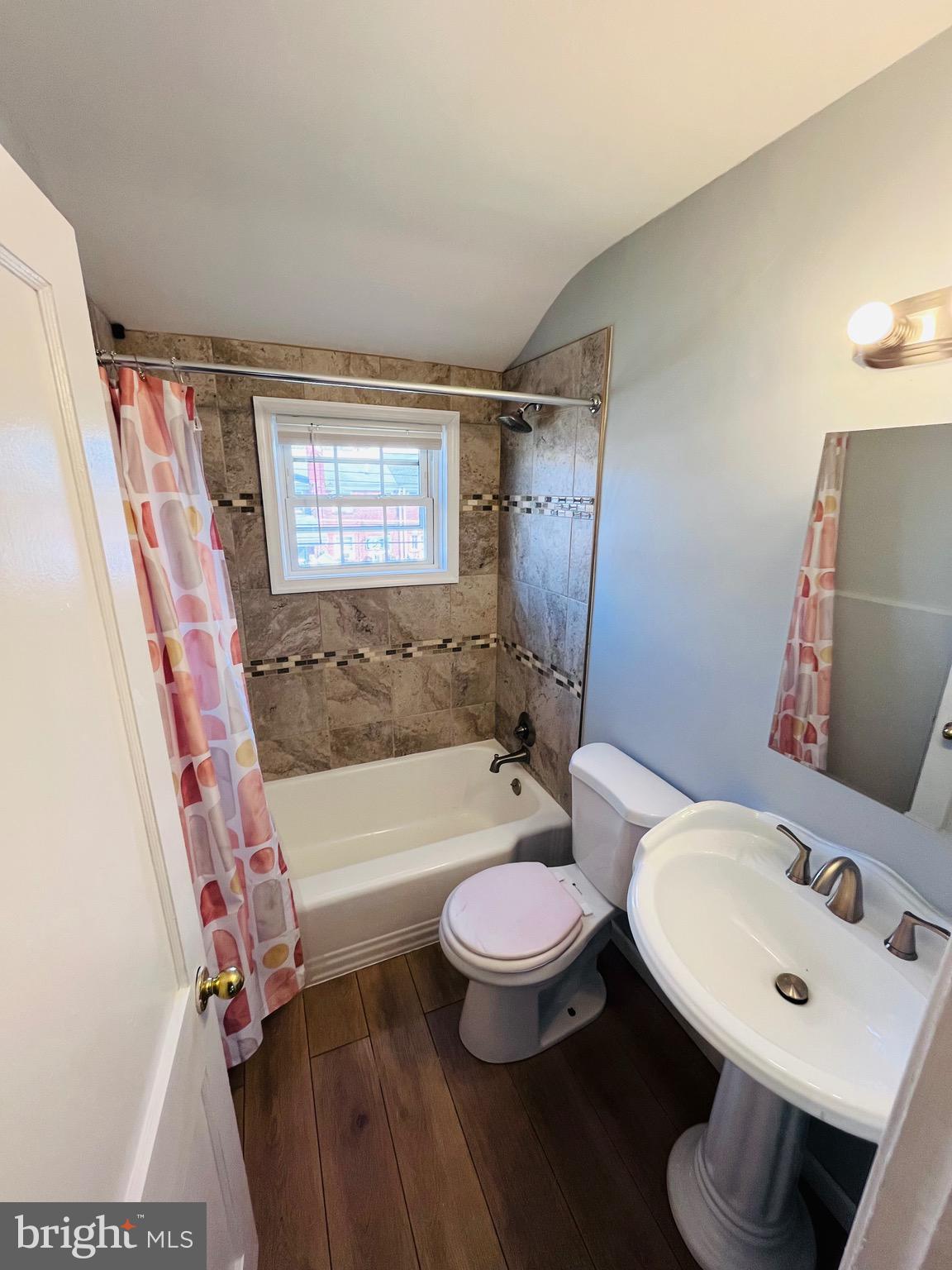 830 Arncliffe Road Baltimore, MD 21221 - Photo 8 of 12 a bathroom with a sink toilet and shower