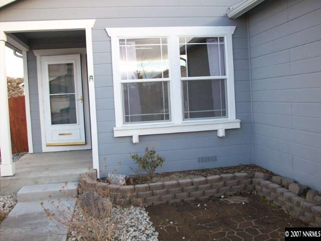 7708 Tulear Street Reno, NV 89506 - Photo 3 of 7 a front view of a house