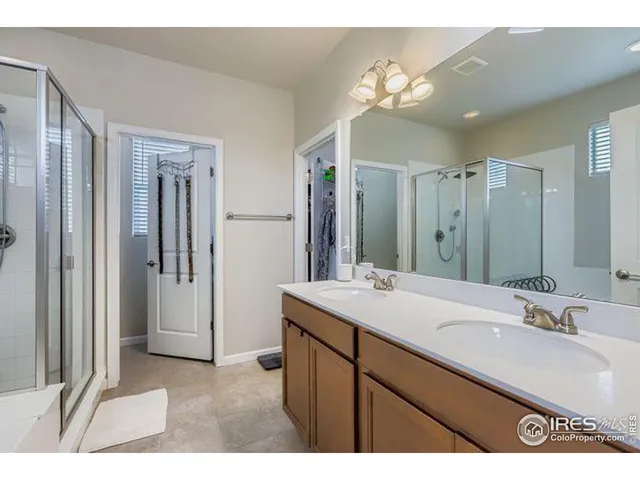 a bathroom with a sink vanity and a mirror