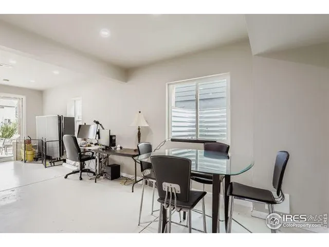 a workspace with furniture and a window