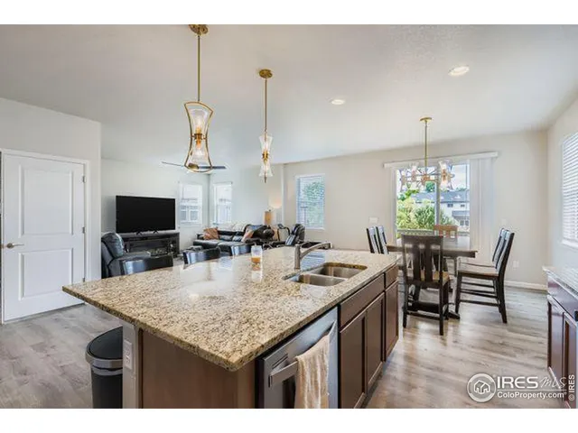a kitchen with a table and chairs in it