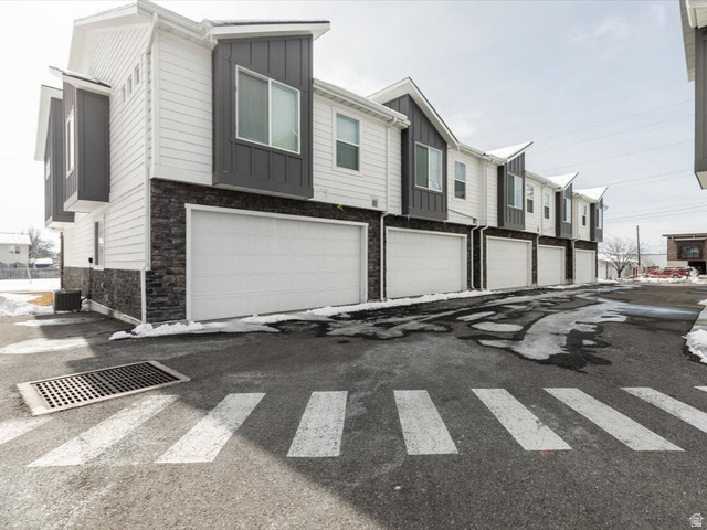 View of asphalt road with a residential view