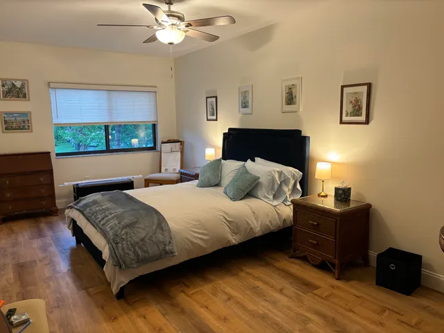 a bedroom with a bed and window