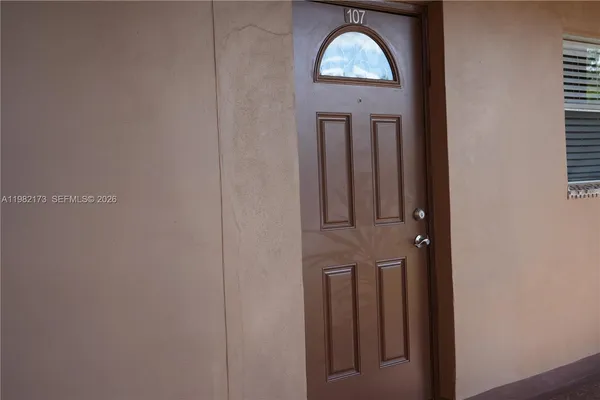 a view of a door with a hallway