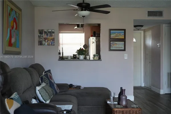a living room with furniture and a window