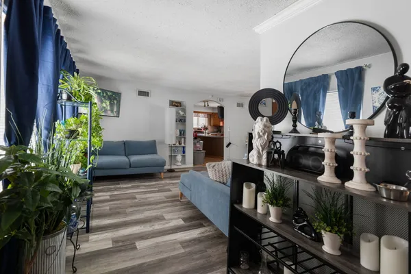 a living room with furniture and a clock