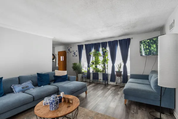 a living room with furniture and a large window