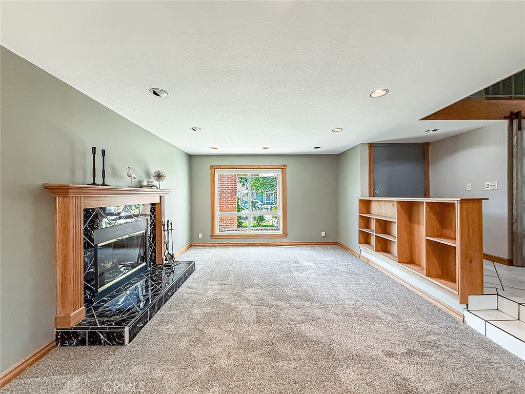 2235 Burnside Street Simi Valley, CA 93065 - Photo 14 of 71 a view of a livingroom with a fireplace and window