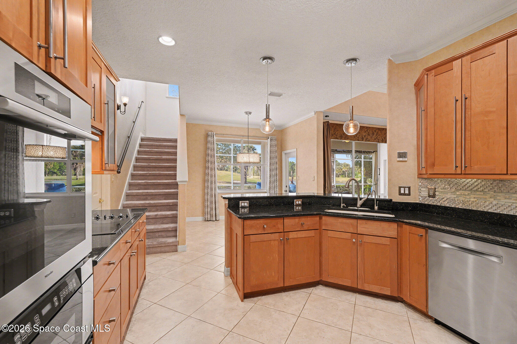 4325 Collingtree Drive Rockledge, FL 32955 - Photo 12 of 35 a large kitchen with a sink and cabinets