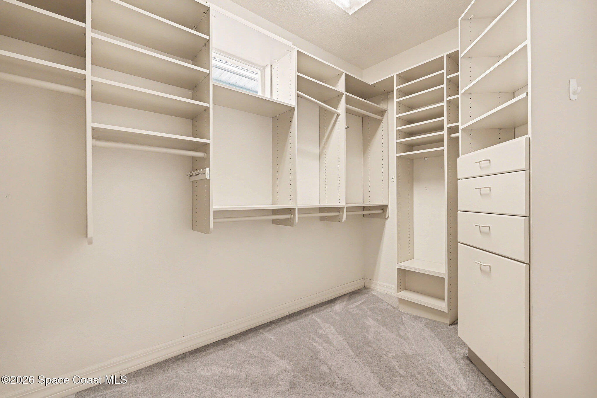 4325 Collingtree Drive Rockledge, FL 32955 - Photo 18 of 35 a view of walk in closet with empty racks