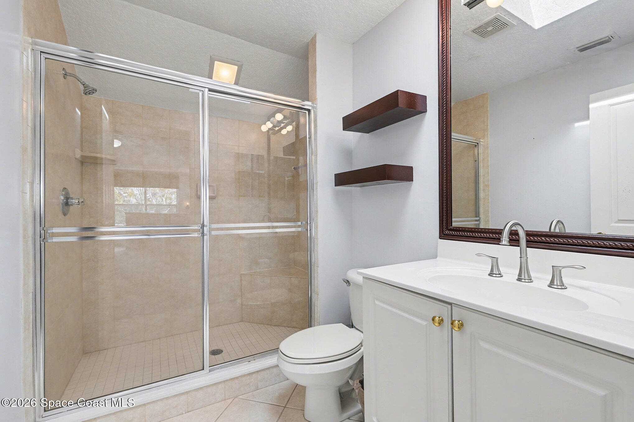 4325 Collingtree Drive Rockledge, FL 32955 - Photo 19 of 35 a bathroom with a sink toilet and shower