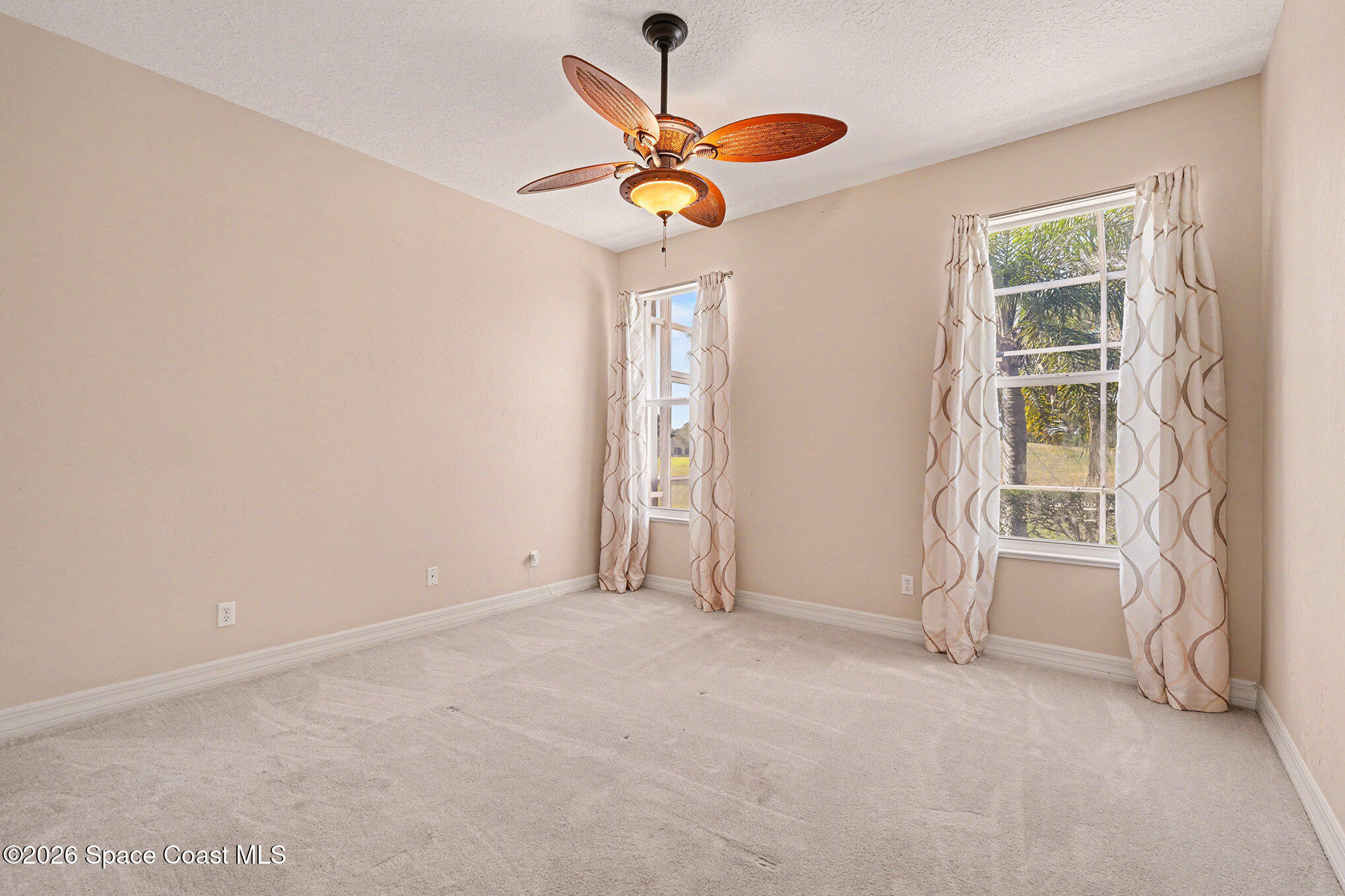 4325 Collingtree Drive Rockledge, FL 32955 - Photo 21 of 35 an empty room with closet and windows