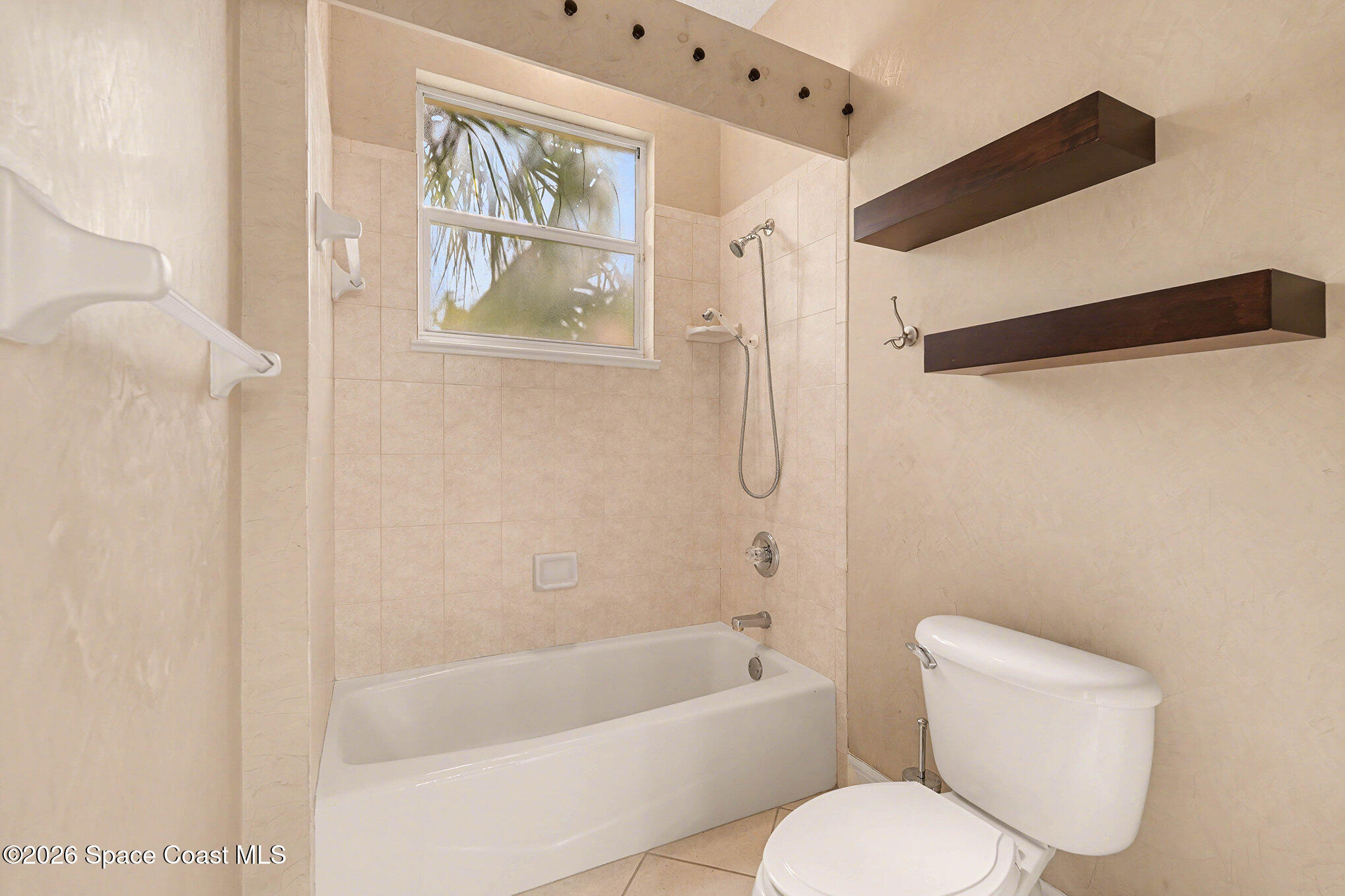 4325 Collingtree Drive Rockledge, FL 32955 - Photo 22 of 35 a bathroom with a toilet and a shower