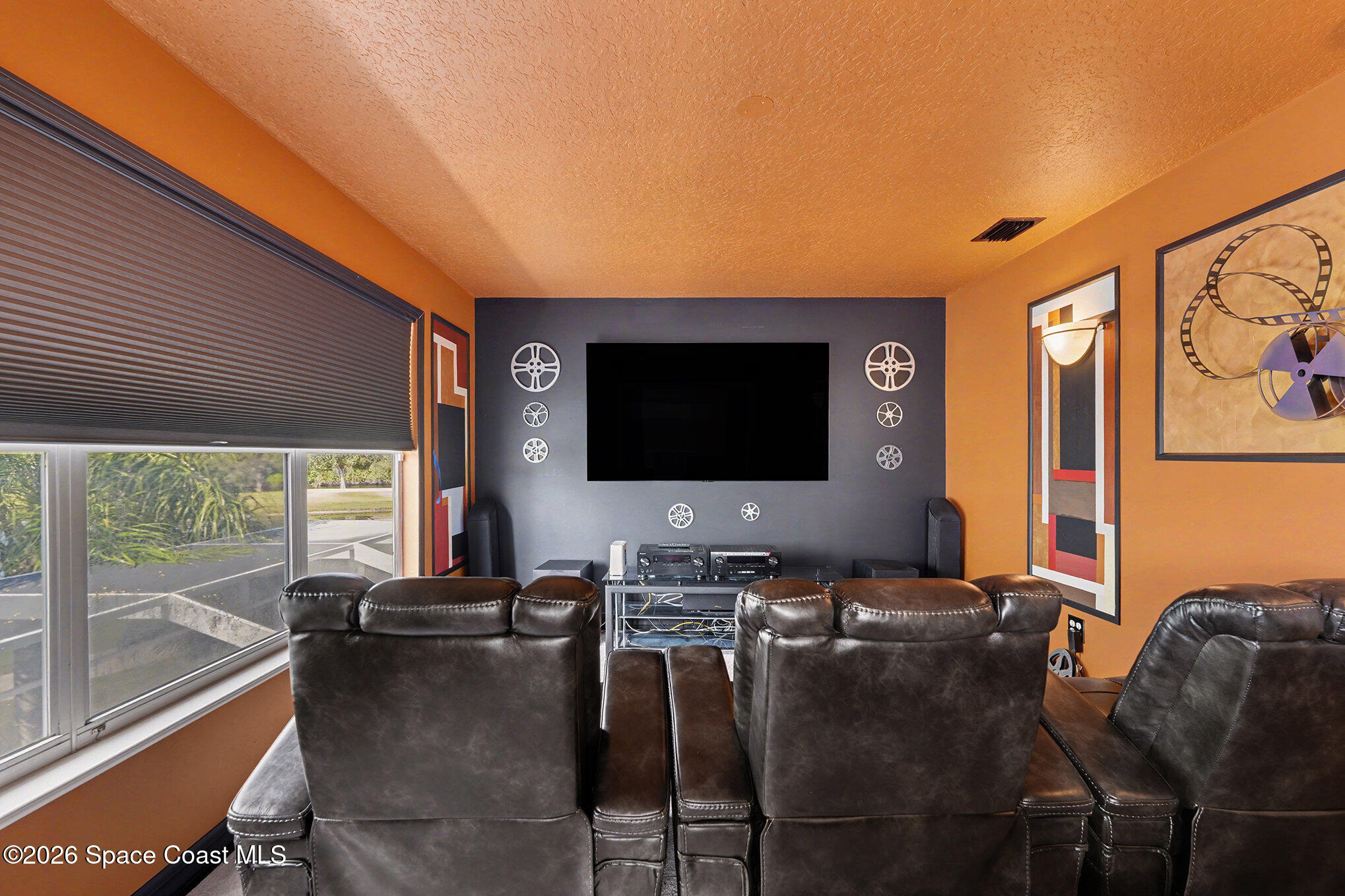 4325 Collingtree Drive Rockledge, FL 32955 - Photo 23 of 35 a living room with furniture and a flat screen tv