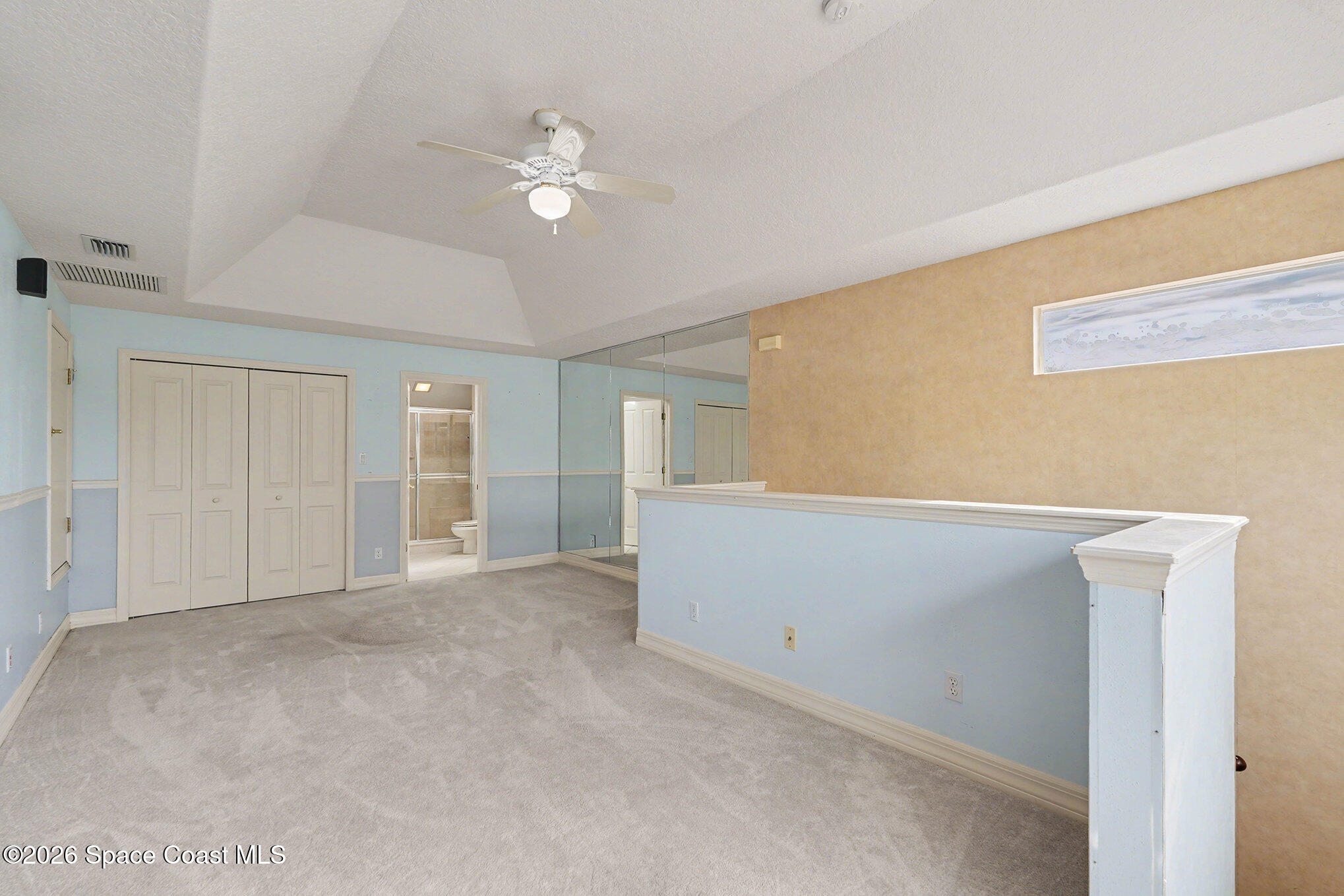 4325 Collingtree Drive Rockledge, FL 32955 - Photo 24 of 35 a view of an empty room with chandelier fan
