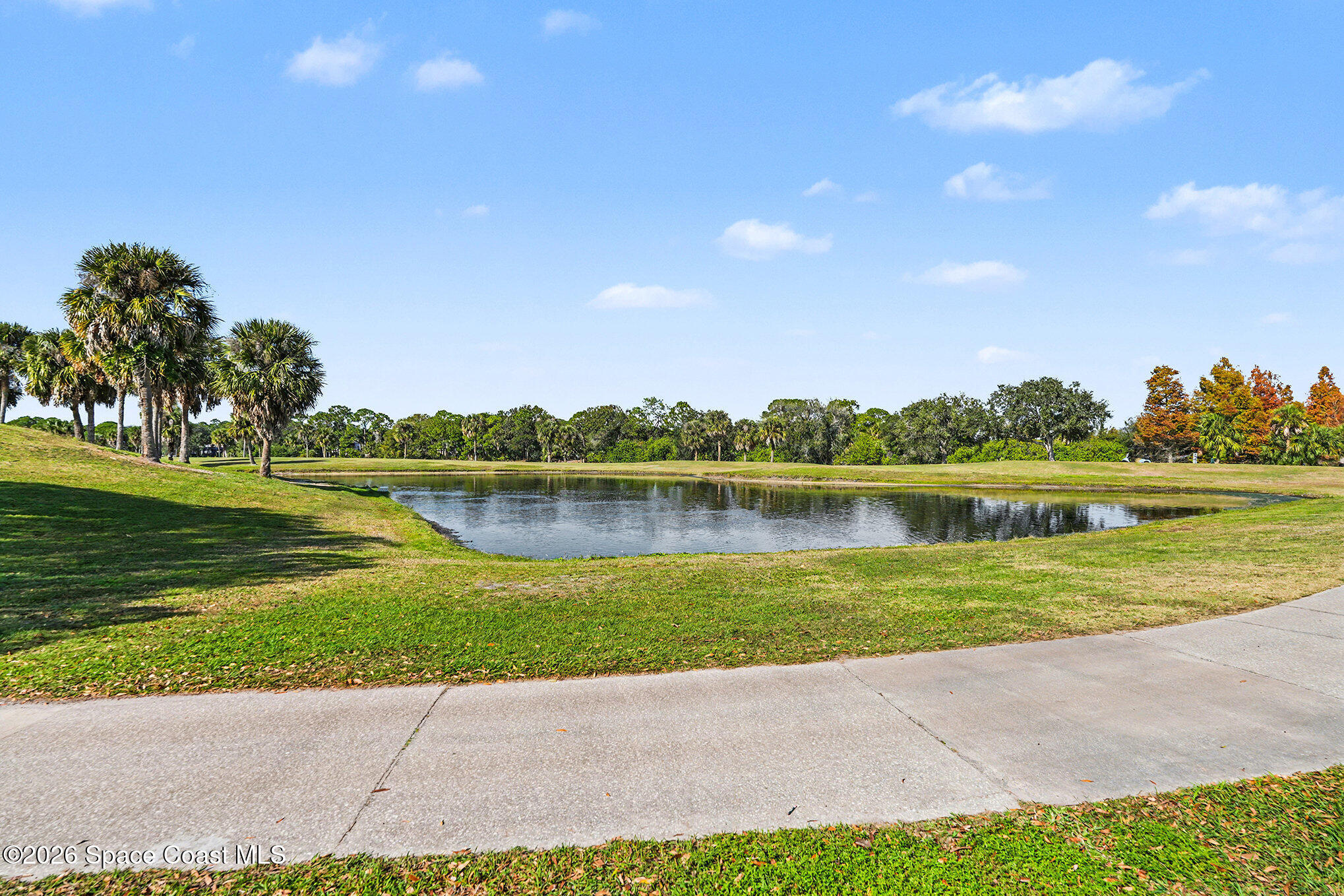 4325 Collingtree Drive Rockledge, FL 32955 - Photo 29 of 35 a view of a lake with a house in background
