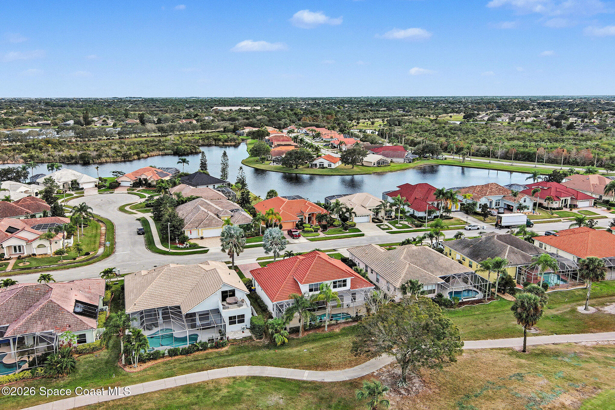 4325 Collingtree Drive Rockledge, FL 32955 - Photo 31 of 35 an aerial view of residential houses with outdoor space and swimming pool