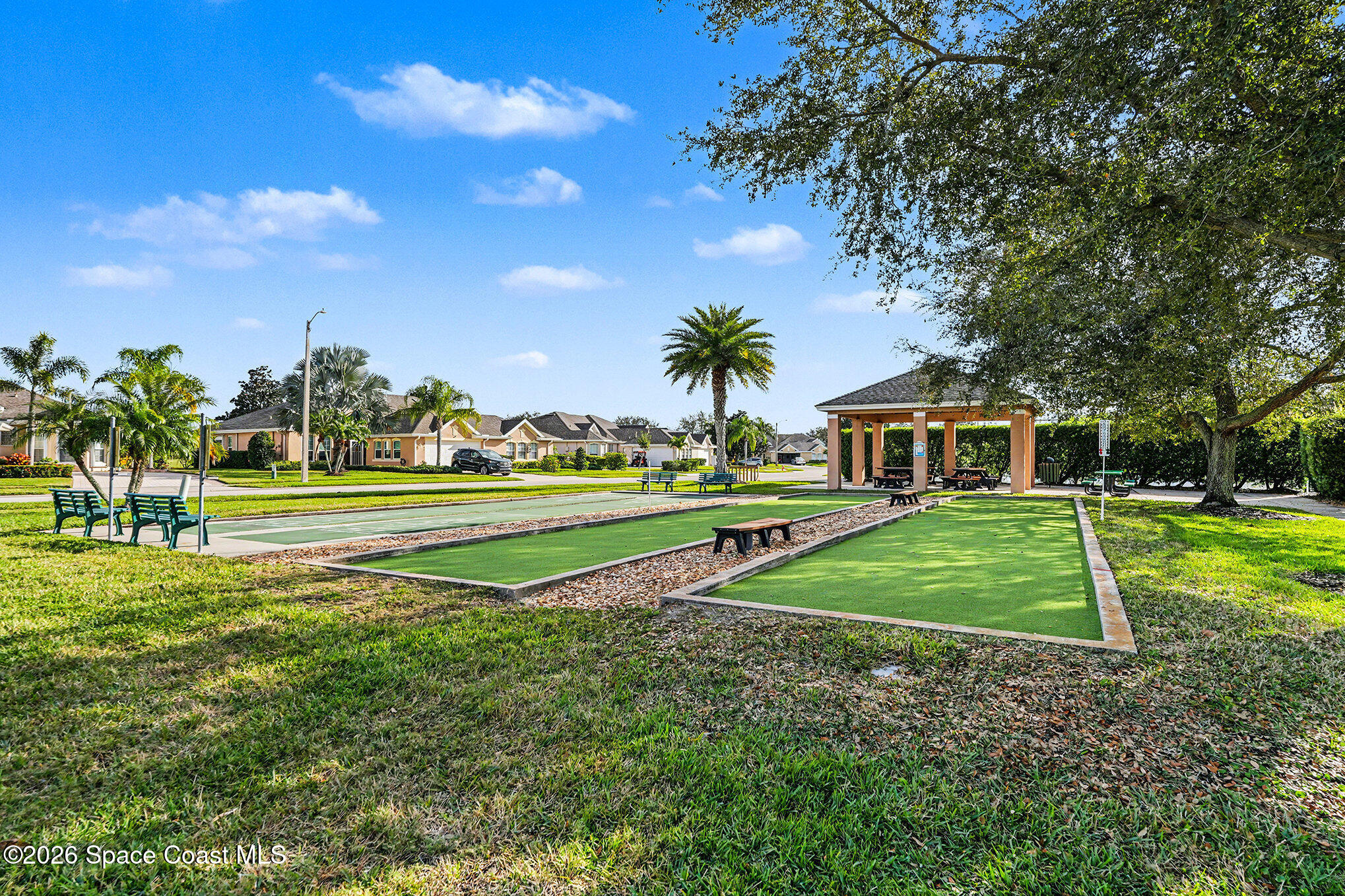 4325 Collingtree Drive Rockledge, FL 32955 - Photo 33 of 35 a view of a house with a big yard and potted plants and large trees