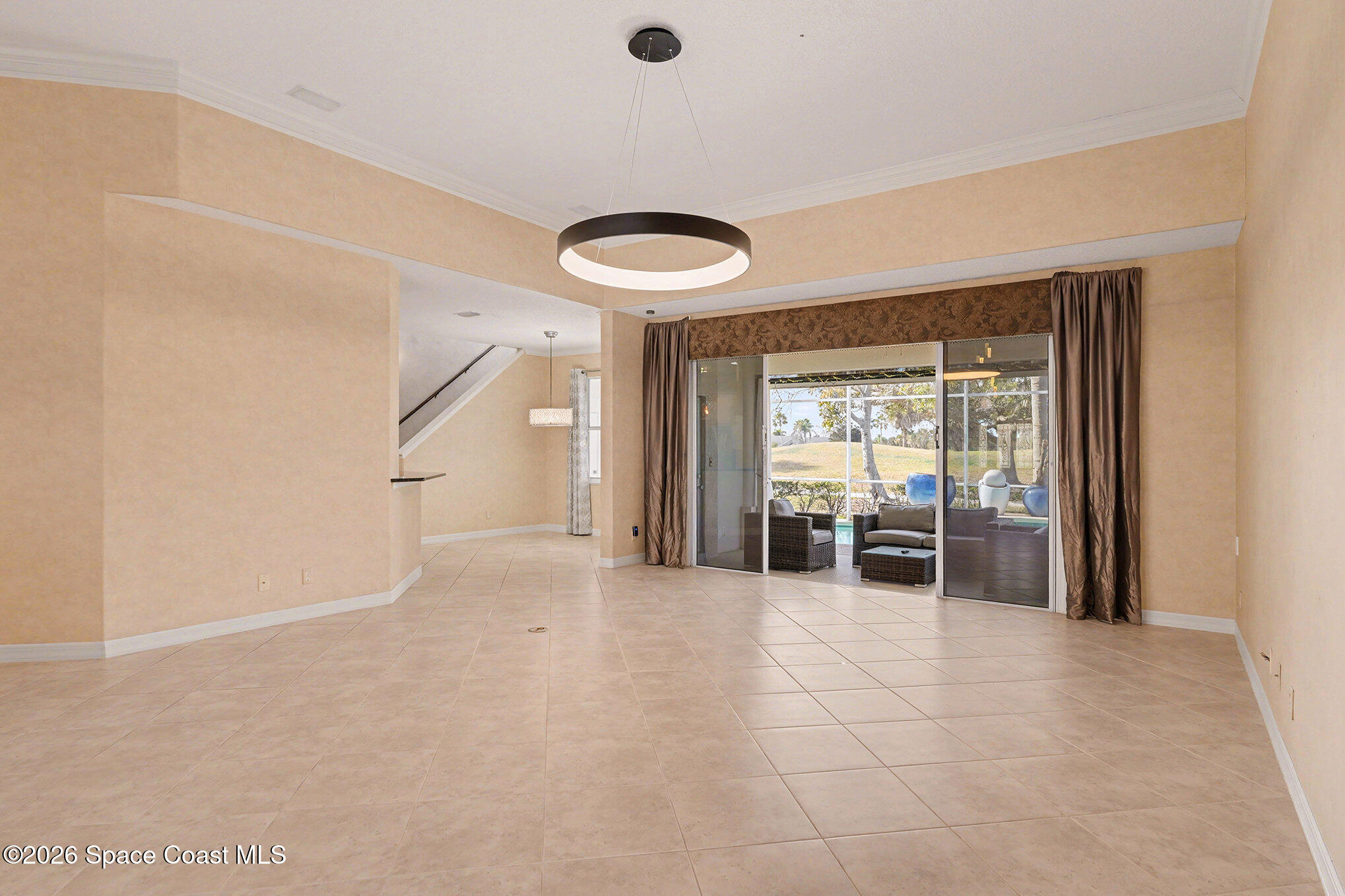 4325 Collingtree Drive Rockledge, FL 32955 - Photo 7 of 35 a view of a livingroom with furniture and entryway