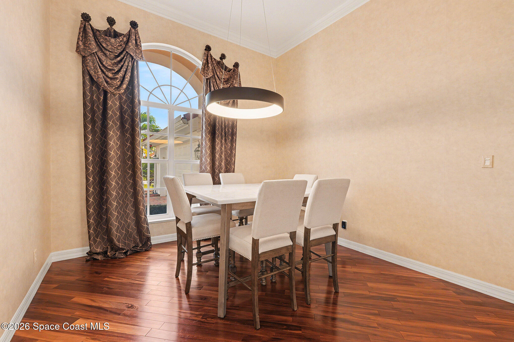 4325 Collingtree Drive Rockledge, FL 32955 - Photo 10 of 35 a view of a dining room with furniture and wooden floor