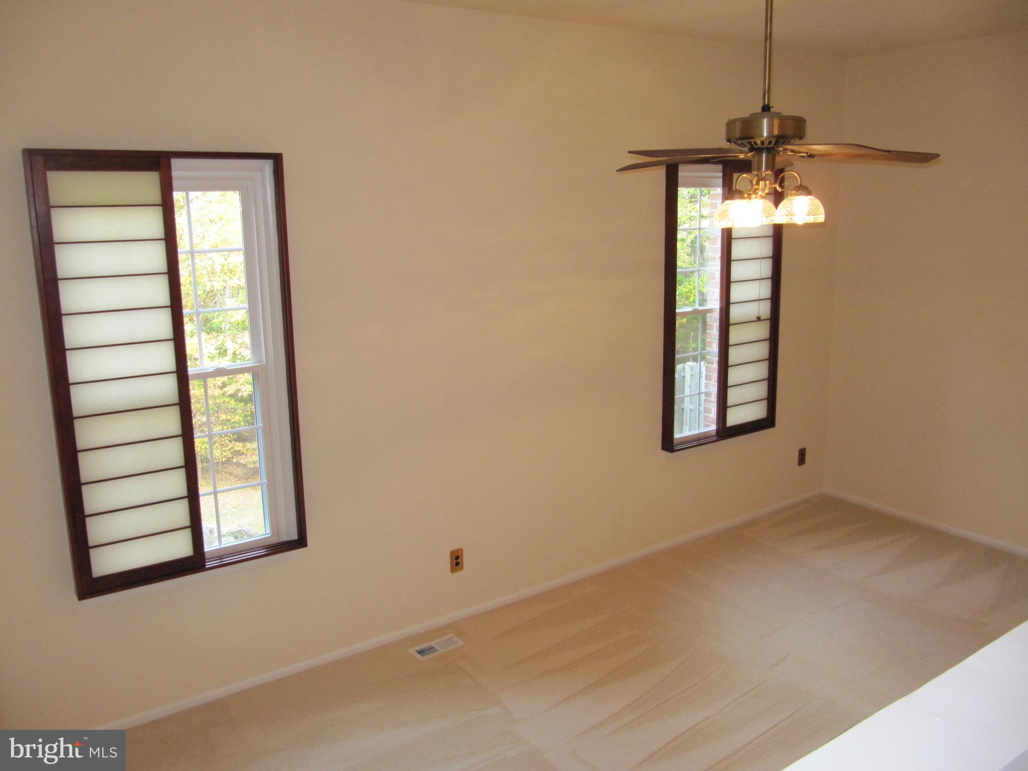 8396 Uxbridge Court Springfield, VA 22151 - Photo 14 of 37 View of Unfurnished Living Room From Dining Room