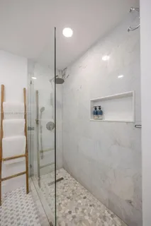 a view of walk in closet with clothes