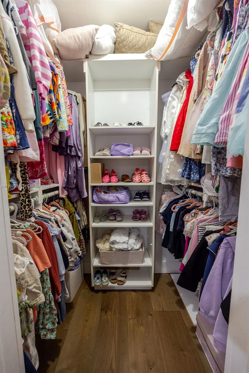11301 Southwest 95th Street Miami, FL 33176 - Photo 33 of 56 a view of walk in closet with clothes