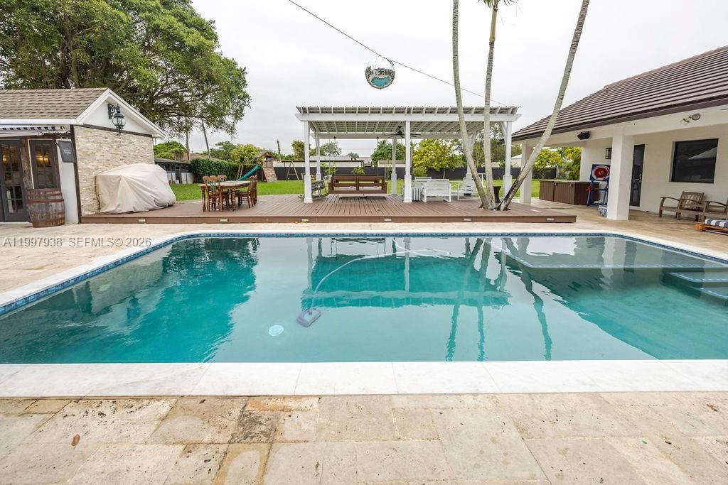 11301 Southwest 95th Street Miami, FL 33176 - Photo 39 of 56 a view of a swimming pool with a patio