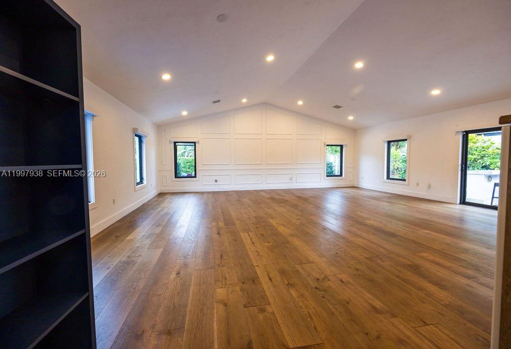 11301 Southwest 95th Street Miami, FL 33176 - Photo 4 of 56 an empty room with wooden floor and windows