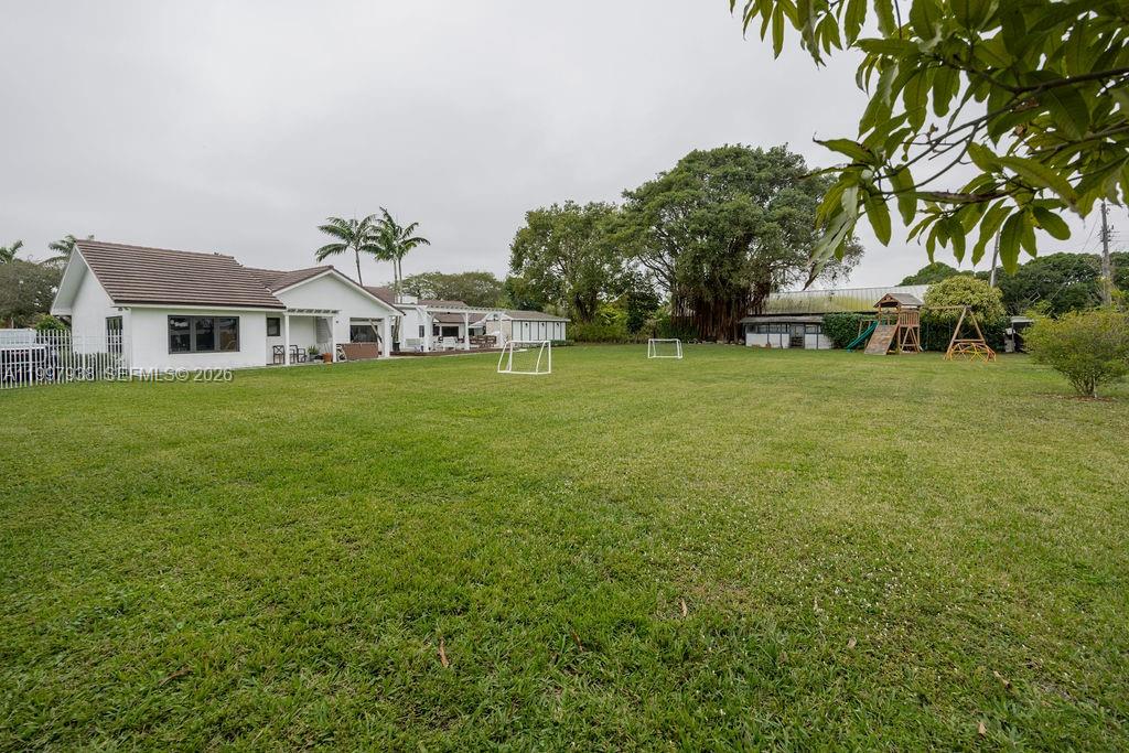 11301 Southwest 95th Street Miami, FL 33176 - Photo 51 of 56 a front view of a house with a garden