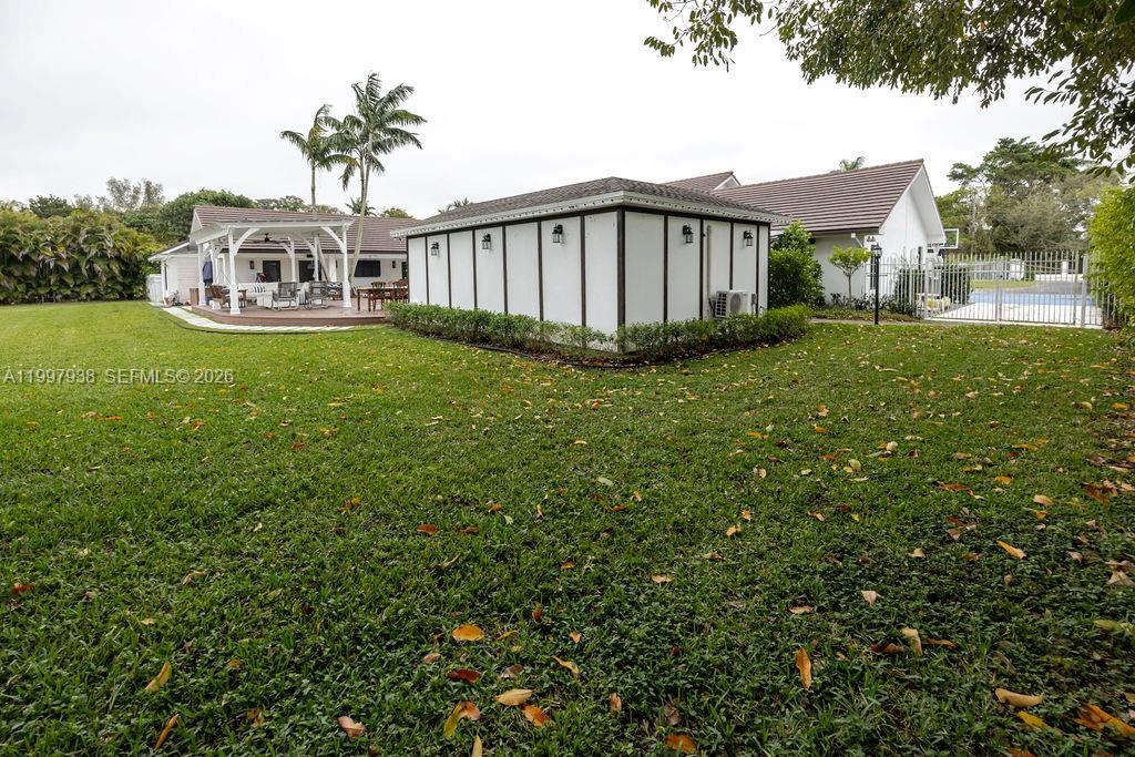 11301 Southwest 95th Street Miami, FL 33176 - Photo 53 of 56 a view of a house with backyard and porch