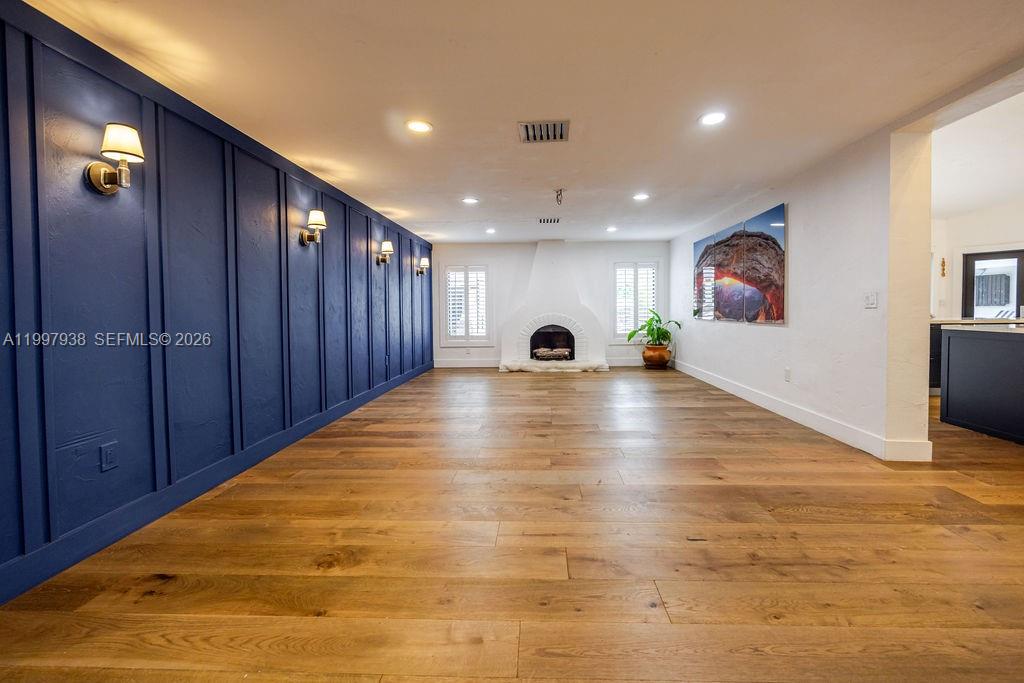 11301 Southwest 95th Street Miami, FL 33176 - Photo 10 of 56 a view of an empty room with wooden floor