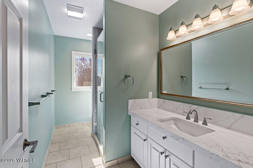 6810 Ravens Gate Way Yakima, WA 98908 - Photo 31 of 49 a bathroom with a sink and a mirror