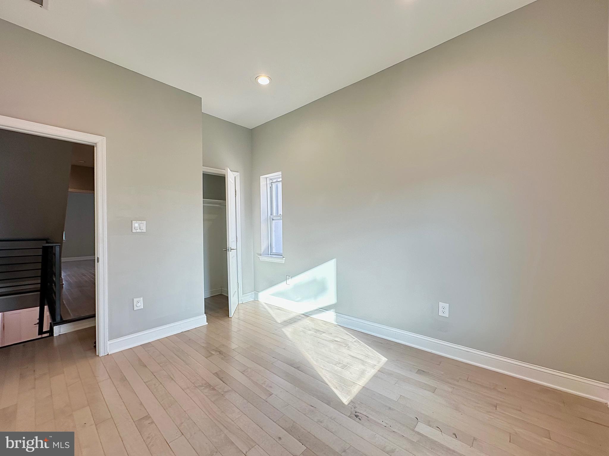 2514 West Seybert Street Philadelphia, PA 19121 - Photo 17 of 38 wooden floor in an empty room with a window